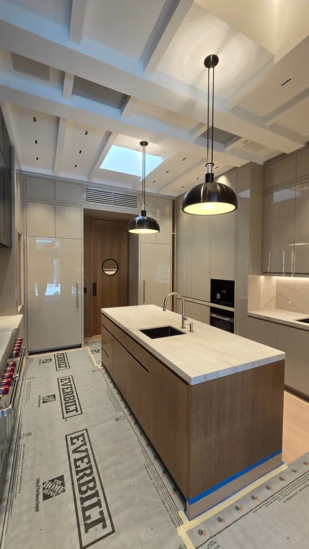Installed custom kitchen cabinetry, island millwork, and a Poplar/Ply Box-Beam Coffered ceiling